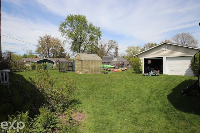 2940 Westland Dr, Port Huron, MI 48060 - view of yard featuring an outbuilding, a greenhouse, and a garage