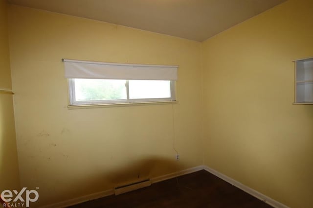 2940 Westland Dr, Port Huron, MI 48060 - unfurnished room featuring baseboard heating and dark wood finished floors