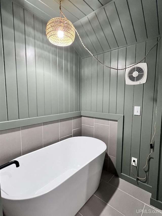 1607 Davidson St, Iron River, MI 49935 - full bathroom with a freestanding tub and tile patterned flooring