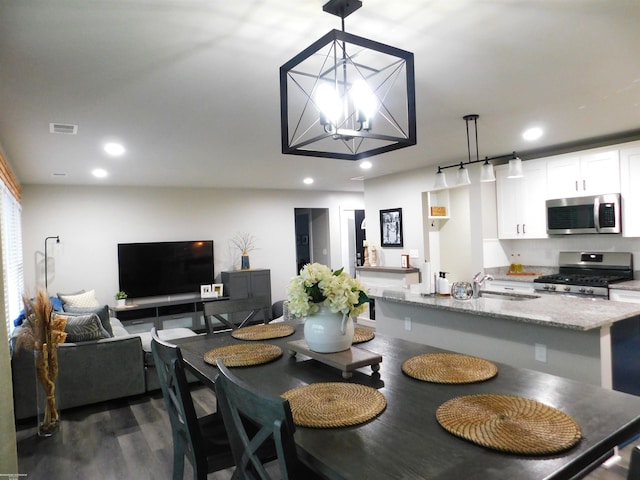 80367 Belle River Rd, Memphis, MI 48041 - dining room with dark wood-type flooring, recessed lighting, and a chandelier