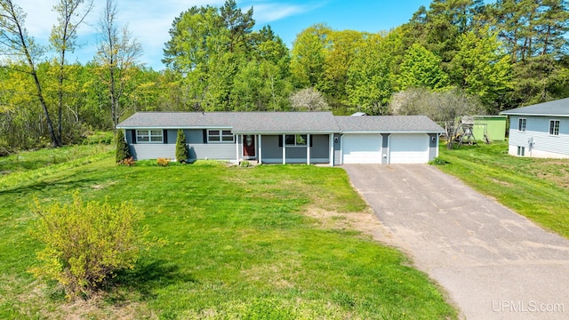 47275 Green Acres Rd, Houghton, MI 49931 - ranch-style house with an attached garage, driveway, and a front yard