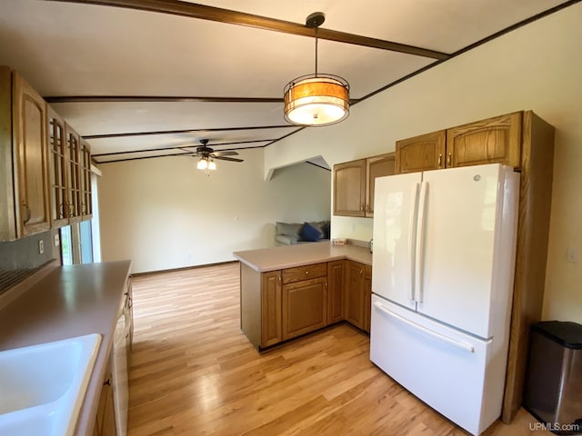 47275 Green Acres Rd, Houghton, MI 49931 - kitchen featuring freestanding refrigerator, light wood finished floors, a ceiling fan, a peninsula, and a sink