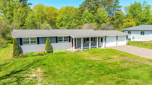 47275 Green Acres Rd, Houghton, MI 49931 - view of front of home with an attached garage, driveway, a front yard, a porch, and a shingled roof