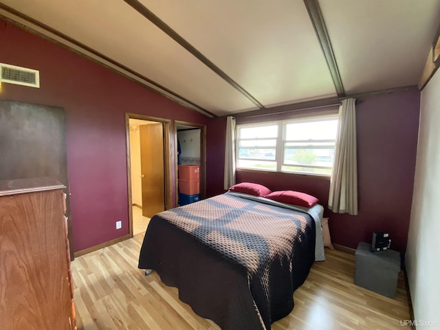 47275 Green Acres Rd, Houghton, MI 49931 - bedroom with vaulted ceiling, light wood-style flooring, and baseboards