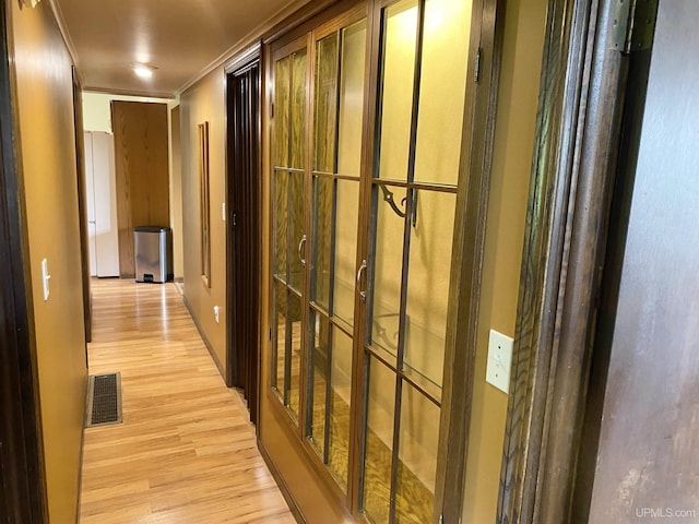 47275 Green Acres Rd, Houghton, MI 49931 - hall with light wood finished floors and crown molding
