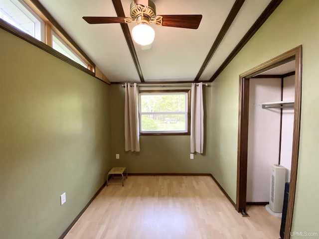 47275 Green Acres Rd, Houghton, MI 49931 - unfurnished bedroom with light wood-style floors, vaulted ceiling, baseboards, a ceiling fan, and a closet