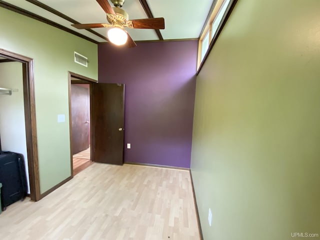 47275 Green Acres Rd, Houghton, MI 49931 - unfurnished bedroom with wood finished floors, baseboards, a ceiling fan, and a closet