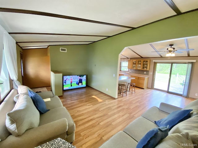 47275 Green Acres Rd, Houghton, MI 49931 - living area featuring light wood-type flooring, arched walkways, and ceiling fan