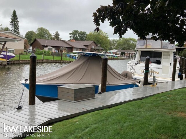 38044 Seaway Ct, Harrison Twp, MI 48045 - dock area with a water view, a yard, boat lift, and a residential view