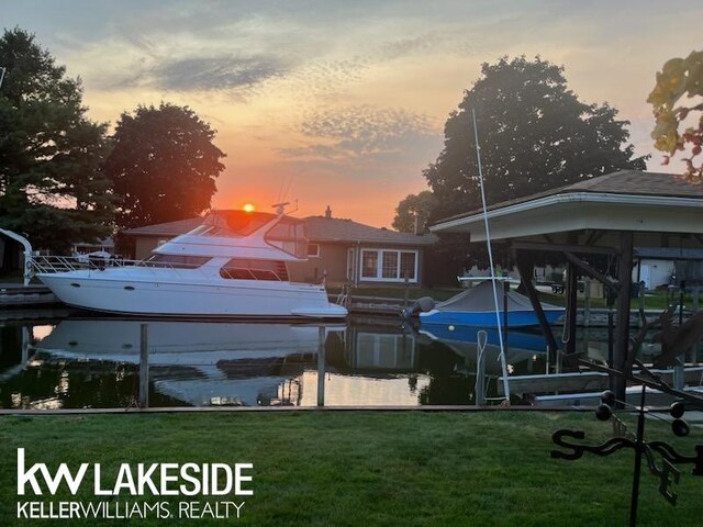 38044 Seaway Ct, Harrison Twp, MI 48045 - dock with boat lift and a lawn