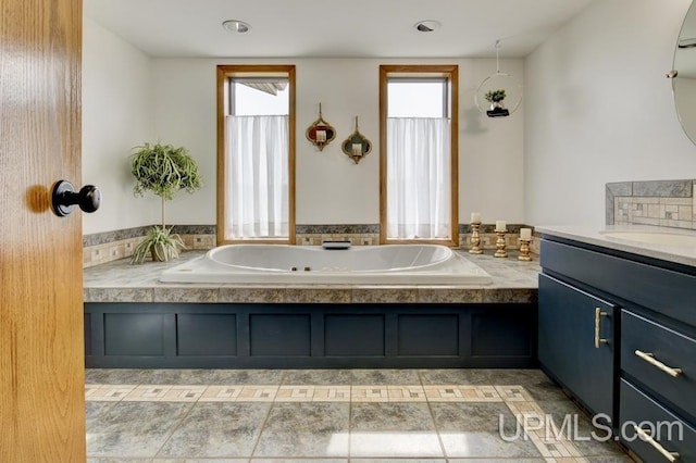 12104 T Rd, Rapid River, MI 49878 - bathroom featuring vanity and a tub with jets