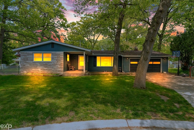 3365 Hickory Ln, Port Huron, MI 48060 - ranch-style house featuring a garage, concrete driveway, stone siding, and covered porch
