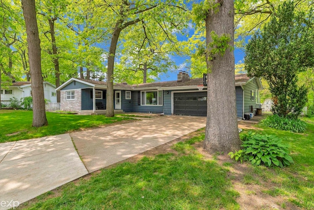 3365 Hickory Ln, Port Huron, MI 48060 - ranch-style home featuring a garage, concrete driveway, a chimney, and a front lawn