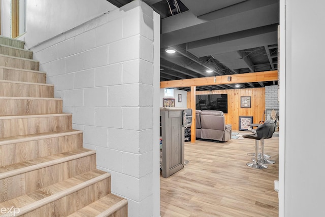 3365 Hickory Ln, Port Huron, MI 48060 - staircase with wood finished floors and concrete block wall