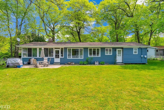 3365 Hickory Ln, Port Huron, MI 48060 - back of house featuring a patio area, a yard, and a chimney