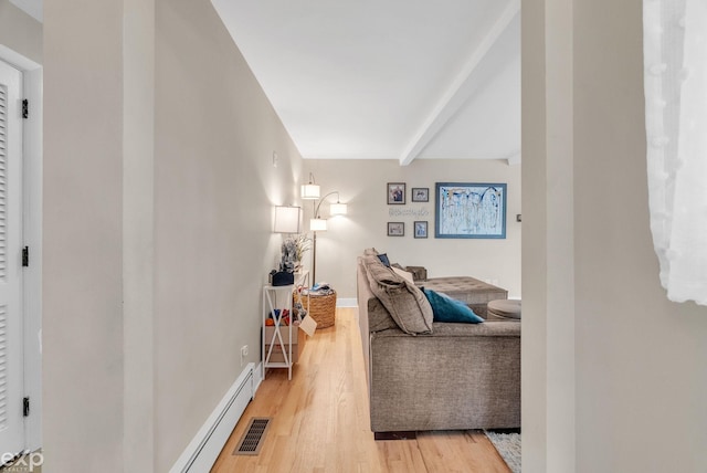 3365 Hickory Ln, Port Huron, MI 48060 - living room with light wood-type flooring, beamed ceiling, baseboard heating, and baseboards