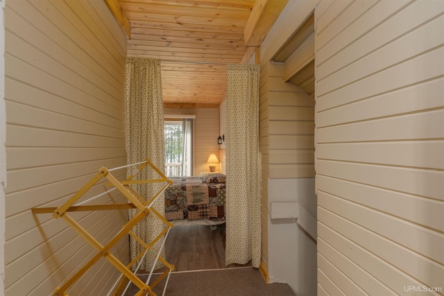 4427 Tip Up Trl, Eagle River, WI 54521 - corridor featuring wooden walls, wooden ceiling, wood finished floors, and an upstairs landing