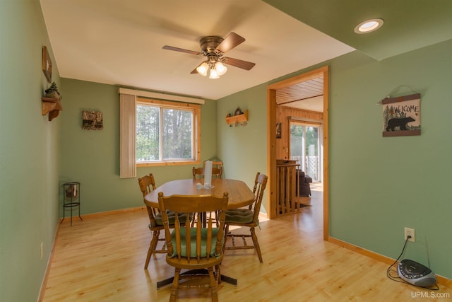 4427 Tip Up Trl, Eagle River, WI 54521 - dining space featuring ceiling fan, light wood-type flooring, and baseboards