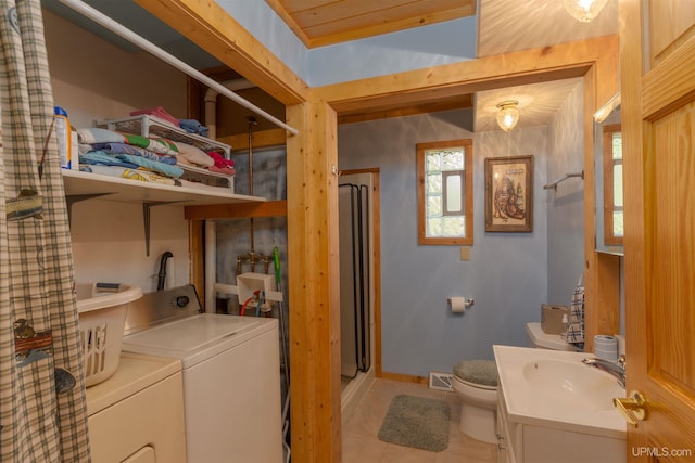 4427 Tip Up Trl, Eagle River, WI 54521 - laundry room with separate washer and dryer, light tile patterned floors, and baseboards