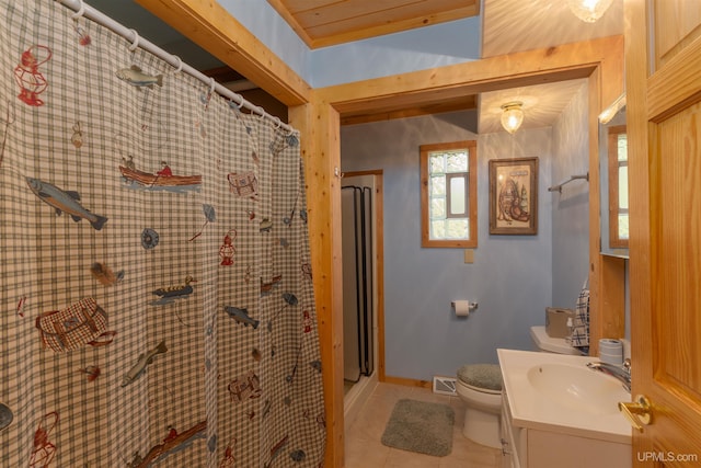 4427 Tip Up Trl, Eagle River, WI 54521 - bathroom with vanity, toilet, tile patterned floors, baseboards, and a shower with curtain