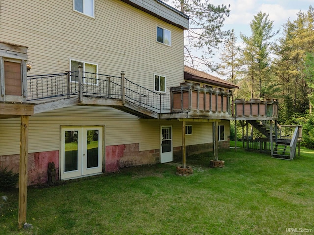 4427 Tip Up Trl, Eagle River, WI 54521 - rear view of property featuring stairs, a yard, french doors, and a wooden deck