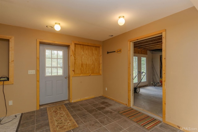 4427 Tip Up Trl, Eagle River, WI 54521 - entryway with plenty of natural light, baseboards, and dark tile patterned flooring