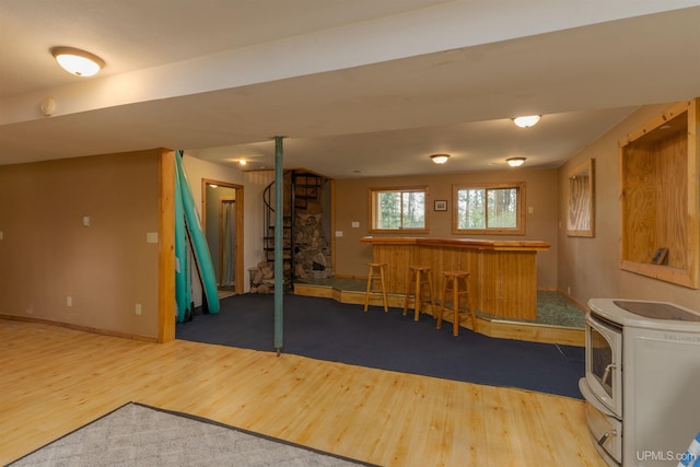 4427 Tip Up Trl, Eagle River, WI 54521 - recreation room with wood finished floors, a dry bar, and baseboards