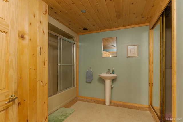 4427 Tip Up Trl, Eagle River, WI 54521 - bathroom with wooden ceiling, combined bath / shower with glass door, a sink, and baseboards
