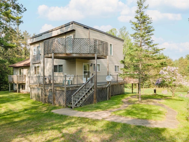 4427 Tip Up Trl, Eagle River, WI 54521 - back of house with a lawn, a wooden deck, and a balcony