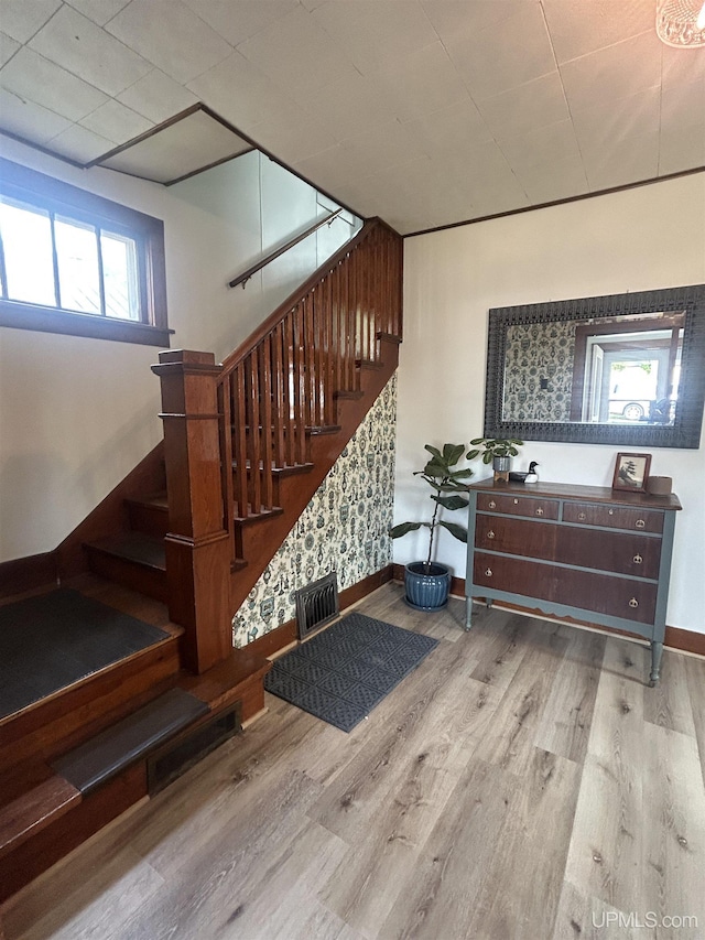 312 N Mckenzie Ave, Negaunee, MI 49866 - staircase featuring wood finished floors and baseboards