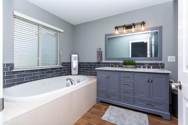 28815 Coleridge St, Harrison Twp, MI 48045 - bathroom featuring double vanity, a bath, and wood finished floors
