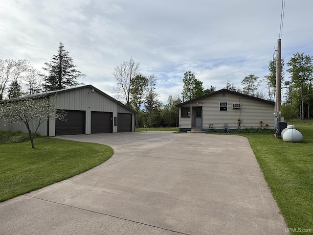 5452 W N Island Lake Rd, Hurley, WI 54534 - view of side of home with a yard, a garage, entry steps, and an outbuilding