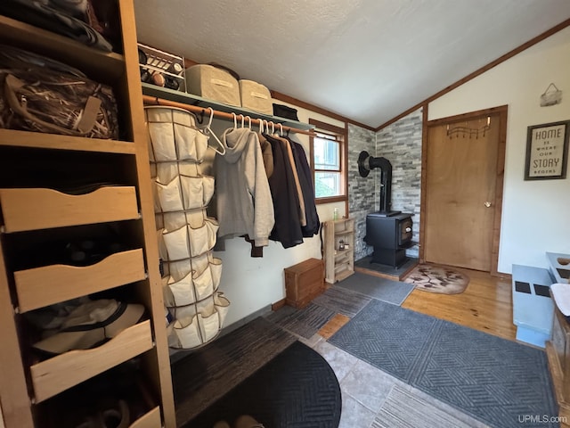 5452 W N Island Lake Rd, Hurley, WI 54534 - walk in closet with vaulted ceiling and a wood stove