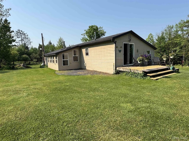 5452 W N Island Lake Rd, Hurley, WI 54534 - back of house featuring a deck and a lawn