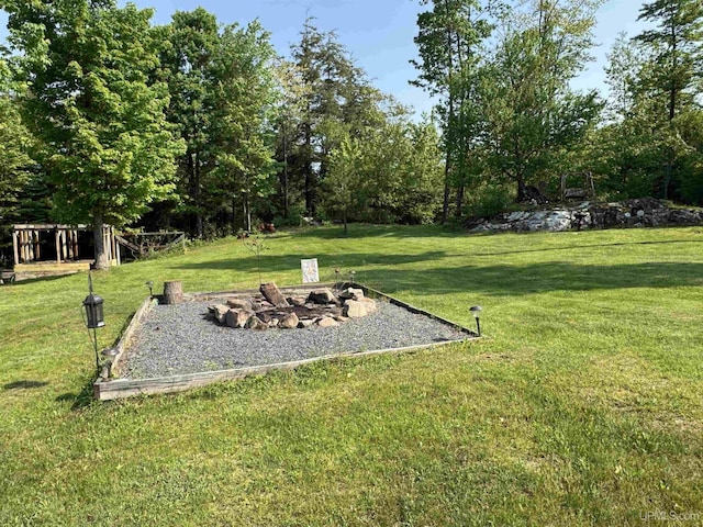 5452 W N Island Lake Rd, Hurley, WI 54534 - view of grassy yard with a fire pit