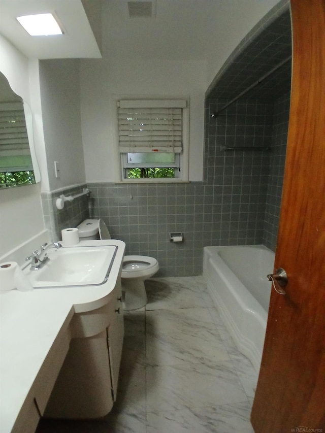 24675 Ridgecroft Ave, Eastpointe, MI 48021 - full bathroom featuring tile walls, vanity, marble finish floors, a bath, and toilet