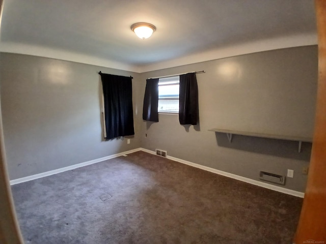 24675 Ridgecroft Ave, Eastpointe, MI 48021 - empty room featuring dark colored carpet and baseboards