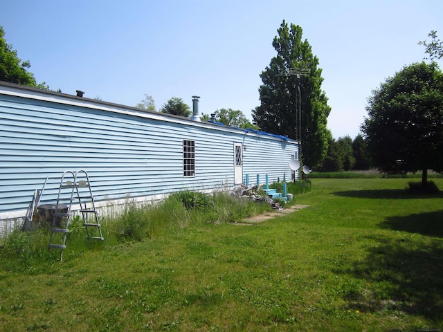1984 E Marlette Rd, Applegate, MI 48401 - view of side of home featuring a lawn