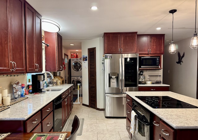 6223 E Townline Lake Rd, Harrison, MI 48625 - kitchen with black appliances, stacked washer / drying machine, dark brown cabinets, a sink, and light stone countertops