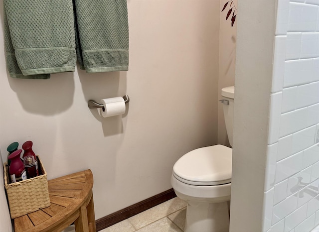 6223 E Townline Lake Rd, Harrison, MI 48625 - bathroom featuring toilet, baseboards, and tile patterned floors