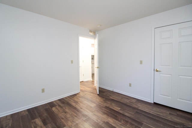 249 Brookwood Dr Unit 4, South Lyon, MI 48178 - unfurnished room featuring dark wood finished floors and baseboards