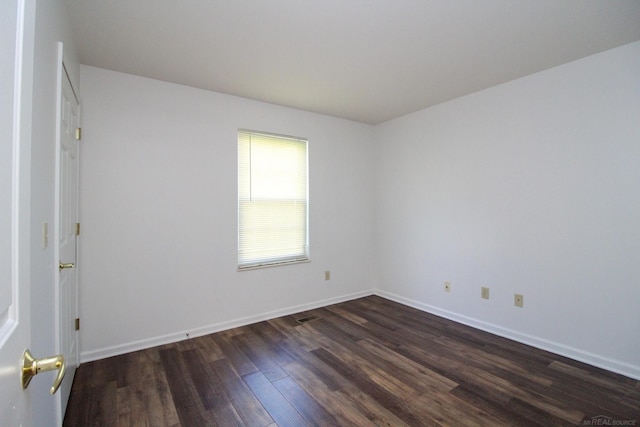 249 Brookwood Dr Unit 4, South Lyon, MI 48178 - unfurnished room featuring dark wood-style flooring and baseboards