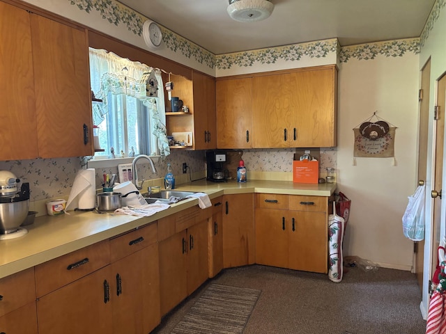 73 S Tuscola Rd, Bay City, MI 48708 - kitchen featuring light countertops, tasteful backsplash, a sink, brown cabinets, and open shelves