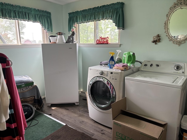 73 S Tuscola Rd, Bay City, MI 48708 - washroom with washing machine and clothes dryer and wood finished floors