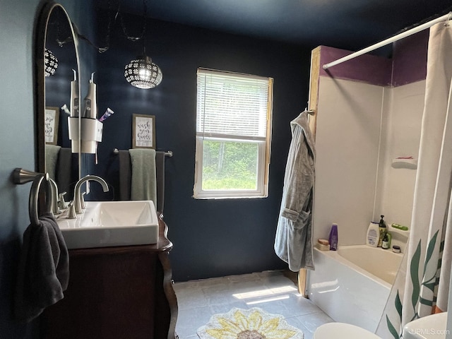 2731 W Jones Rd, Gulliver, MI 49840 - bathroom featuring tile patterned floors, shower / bath combo, vanity, and toilet