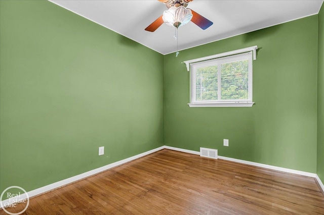 18467 Pershing St, Livonia, MI 48152 - empty room with baseboards, wood finished floors, and a ceiling fan