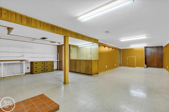 18467 Pershing St, Livonia, MI 48152 - finished below grade area with tile patterned floors and wood walls