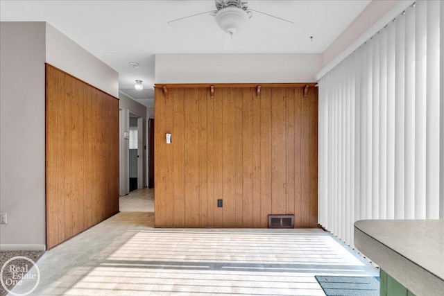 18467 Pershing St, Livonia, MI 48152 - unfurnished room featuring ceiling fan and wood walls