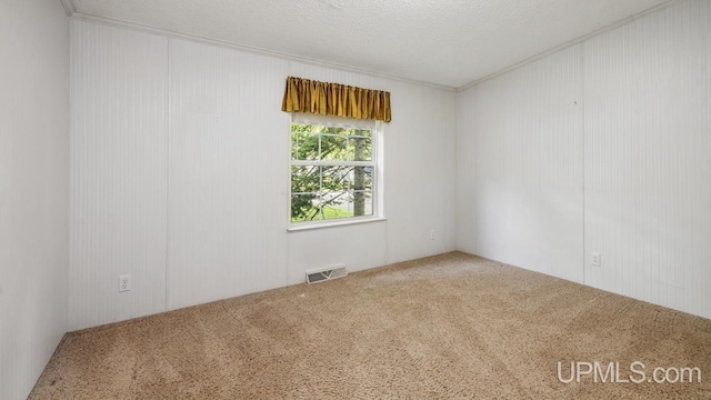 2600 S Hill Rd, Gladstone, MI 49837 - carpeted spare room with crown molding