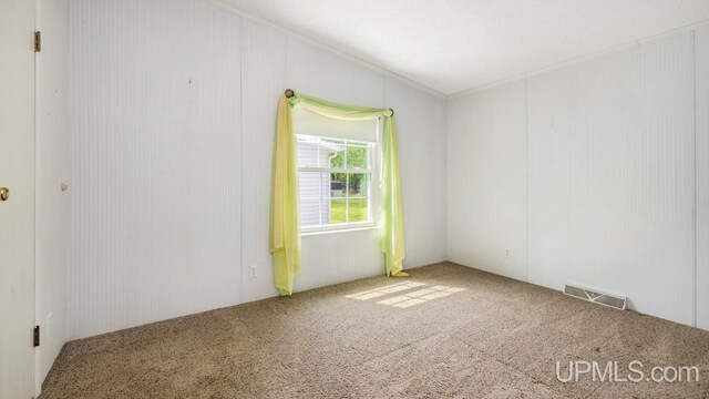 2600 S Hill Rd, Gladstone, MI 49837 - empty room with carpet floors and ornamental molding